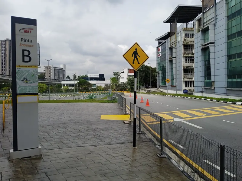 Entrance B sign and pedestrian crossing at Sri Damansara Sentral MRT station