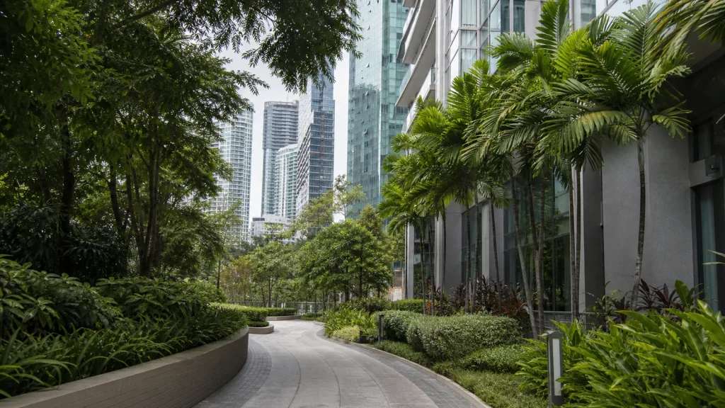 Landscaped pedestrian path beside high-rise residences in central Kuala Lumpur