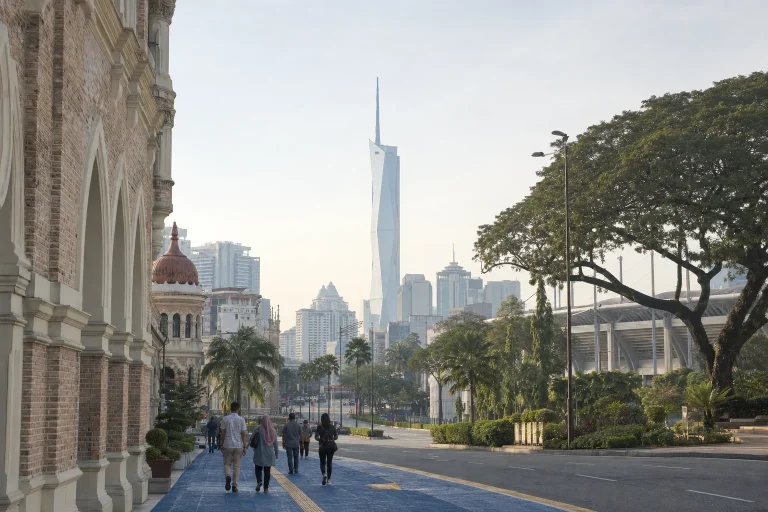 Residents walking through the wider heritage and modern city area around the Merdeka precinct