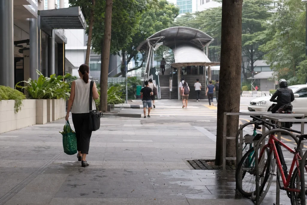 Resident beginning a car-free morning journey from a Central KL condominium to rail