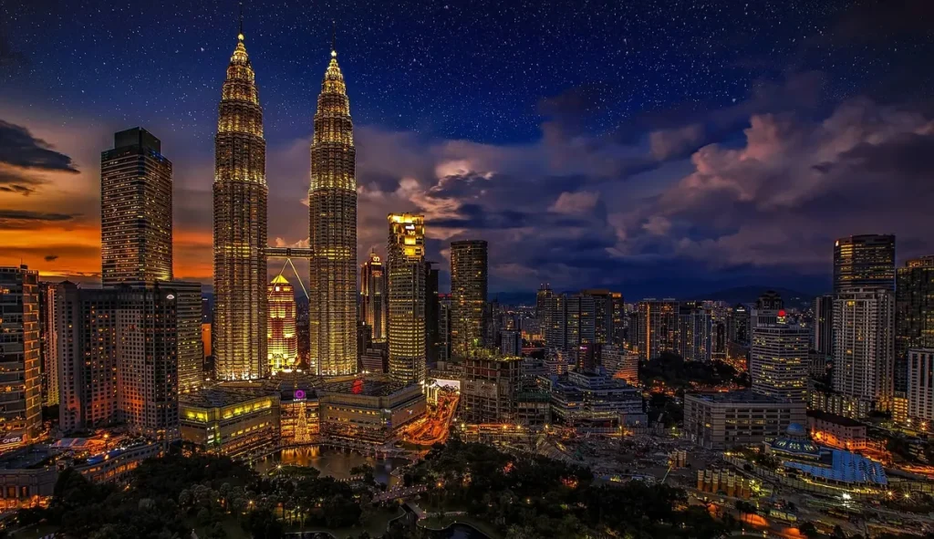 Petronas Twin Towers and the Kuala Lumpur skyline at dusk