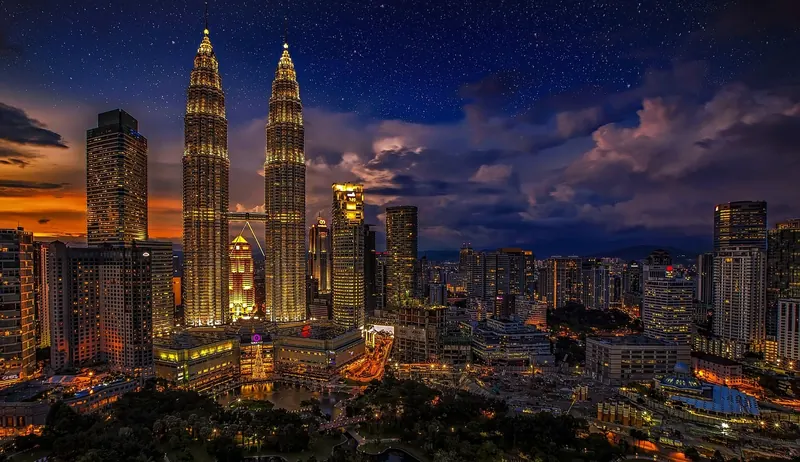 Petronas Twin Towers and the Kuala Lumpur skyline at dusk