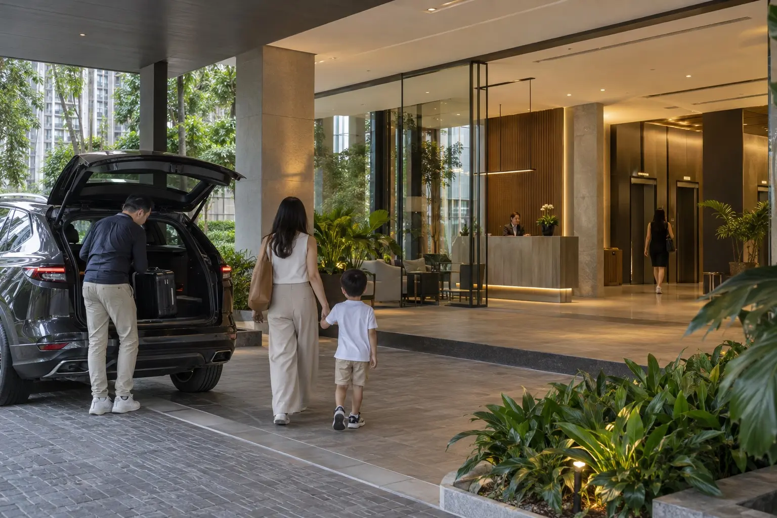 Family arriving at the secure lobby of a luxury condominium in Damansara Heights