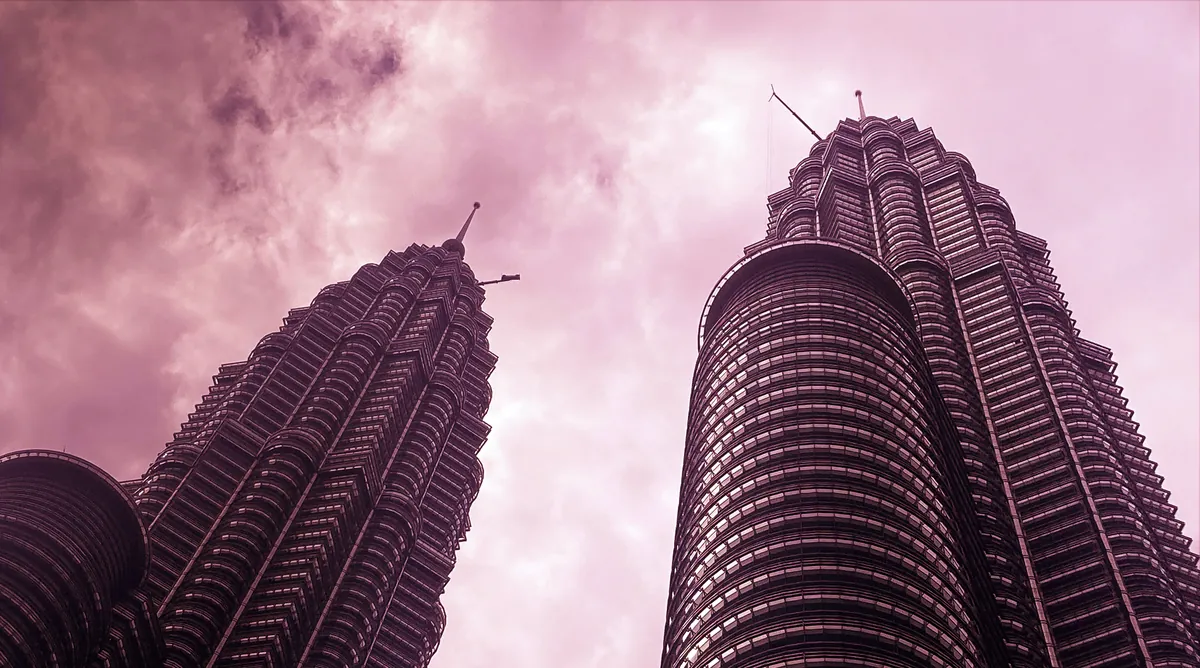 Petronas Twin Towers viewed from below in a tinted photograph