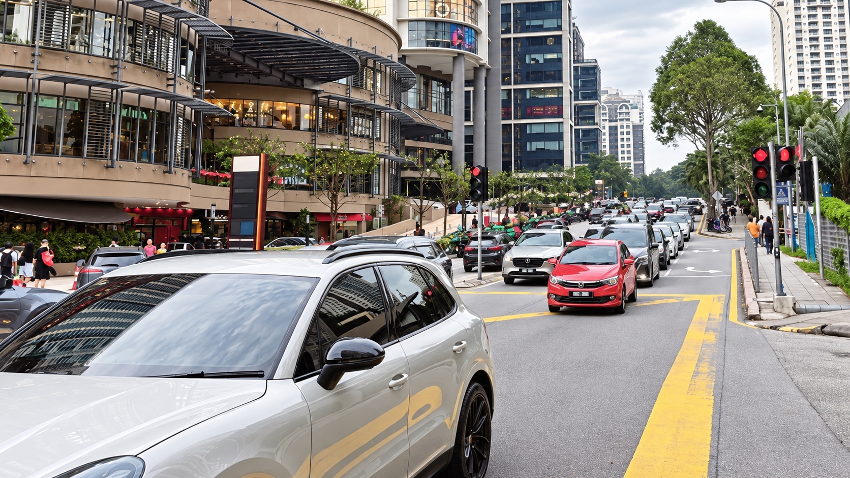 Traffic, neighbourhood shops and high rise residences along a Mont Kiara street